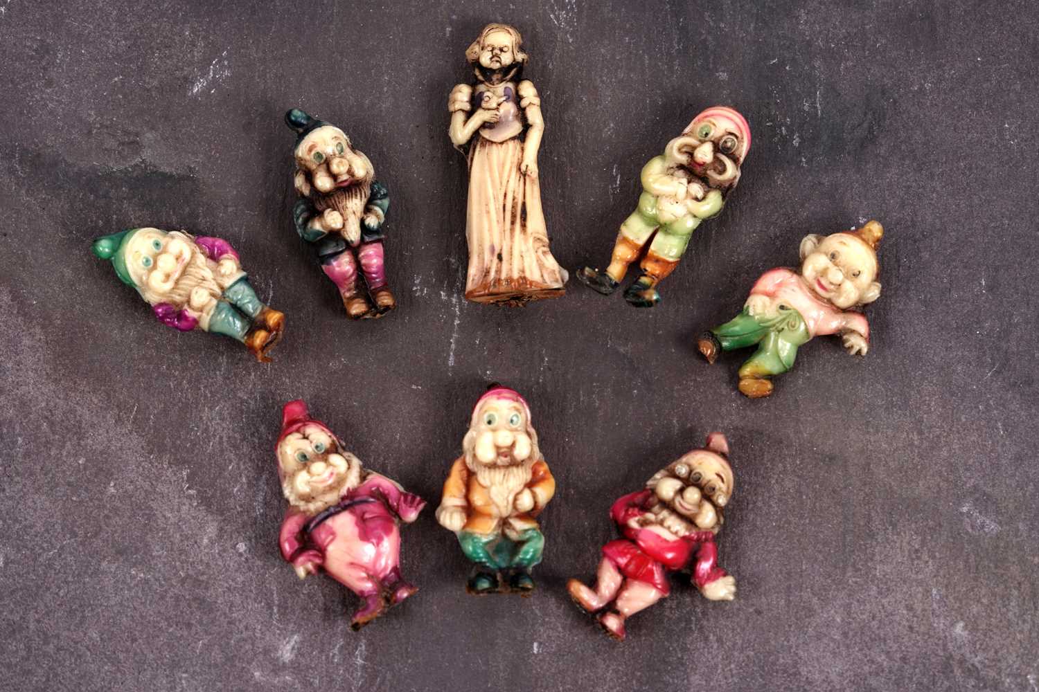 Lot 569 - A complete set of late 1930's Snow White and the Seven Dwarfs charms