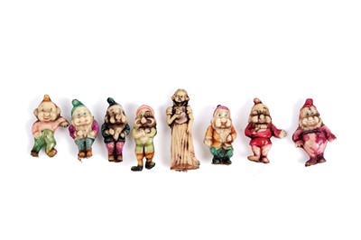 Lot 569 - A complete set of late 1930's Snow White and the Seven Dwarfs charms