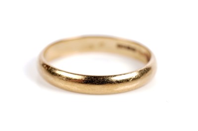 Lot 525 - A ruby and diamond ring; and an 18ct gold wedding band