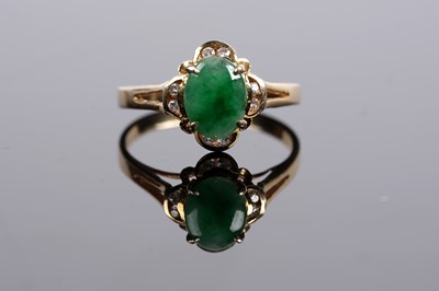 Lot 526 - A jadeite and diamond ring and earring set
