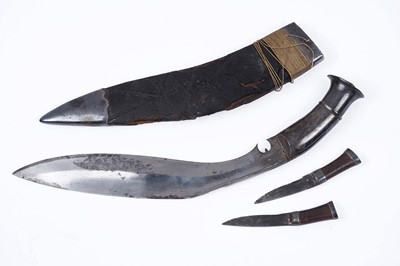 Lot 307 - A kukri with white metal grip; and two similar chakmak