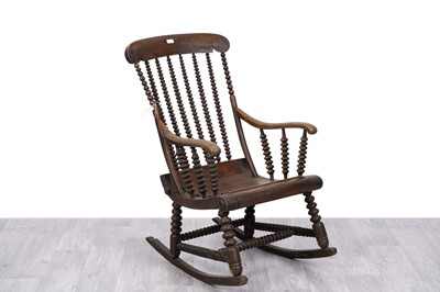 Lot 10 - A Victorian bobbin turned beech rocking chair
