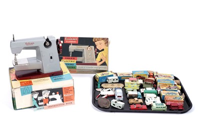 Lot 380 - A collection of boxed and loose diecast vehicles; and a Vulcan child’s electric sewing machine