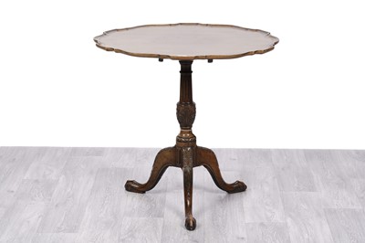 Lot 9 - A Victorian carved mahogany tripod table