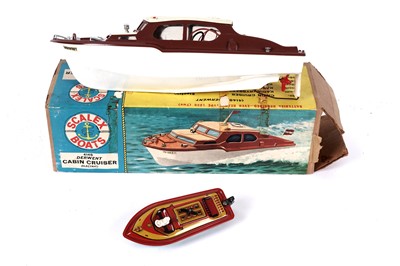 Lot 361 - A boxed Derwent Cabin Cruiser; and a tinplate clockwork boat