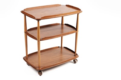 Lot 677 - An Ercol model 458 ‘Windsor’ elm and beech three tier drinks trolley