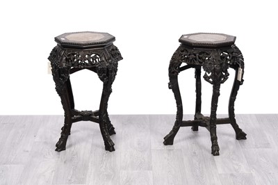 Lot 48 - A pair of early 20th Century Chinese carved ebonized hardwood jardiniere stands