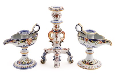 Lot 376 - A Faience style candle stick; and a pair of Majolica chamber sticks