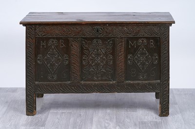 Lot 76 - An 18th Century carved oak coffer