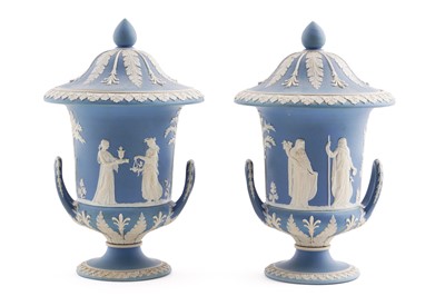 Lot 321 - A pair of Wedgwood Jasperware twin handled covered vases