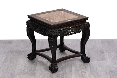 Lot 64 - An early 20th Century Chinese carved and stained hardwood jardinière stand