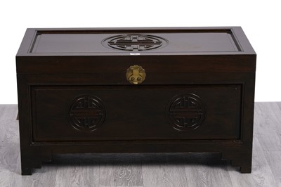 Lot 60 - A Chinese style stained and carved hardwood blanket box
