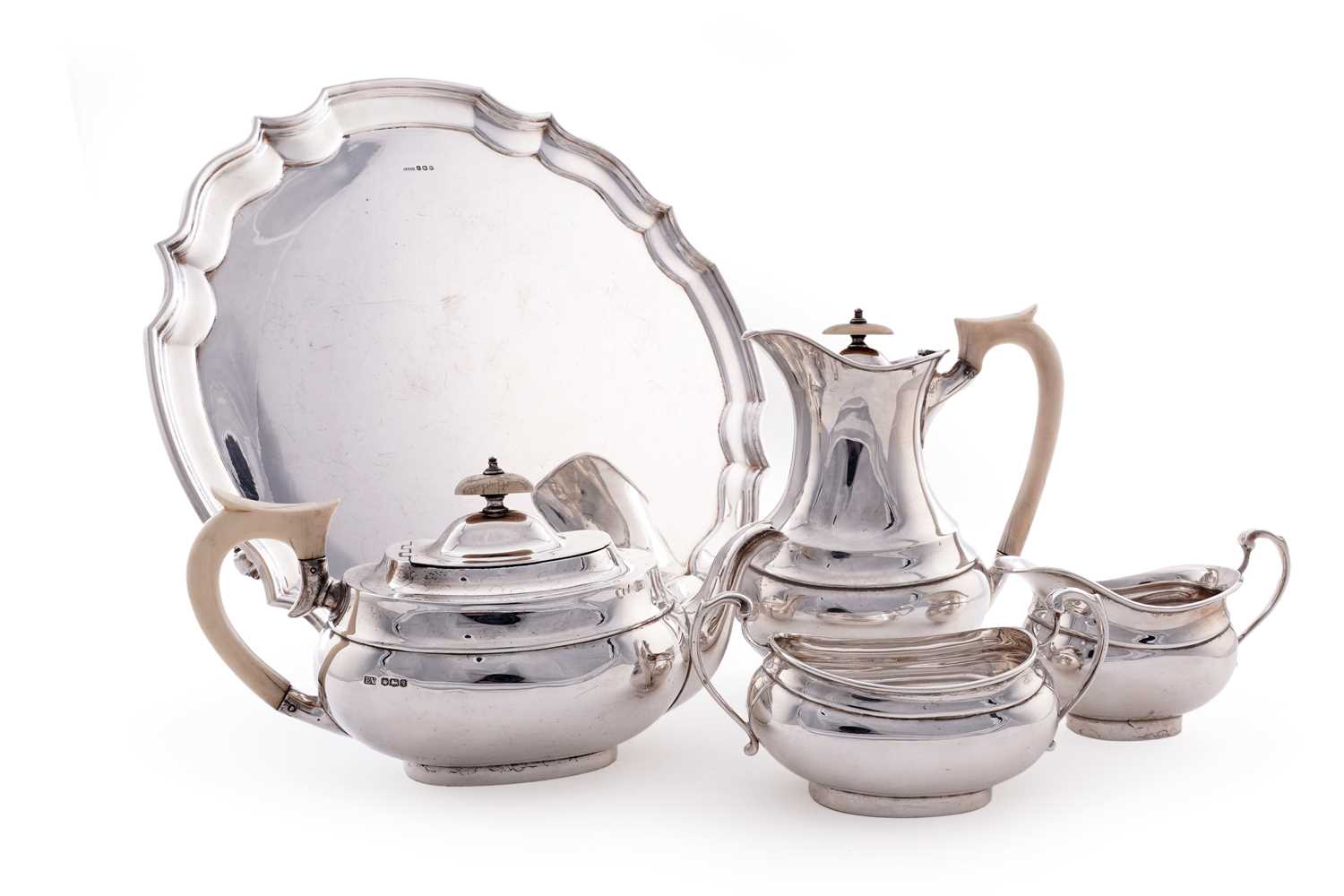 Lot 15 - A George V silver four piece tea service; and an Elizabeth II silver salver
