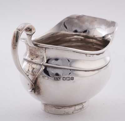Lot 15 - A George V silver four piece tea service; and an Elizabeth II silver salver