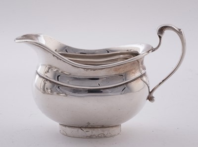 Lot 15 - A George V silver four piece tea service; and an Elizabeth II silver salver