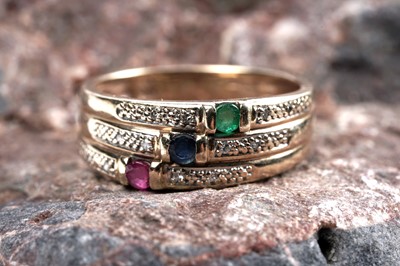 Lot 88 - A modern sapphire, ruby, emerald and diamond dress ring