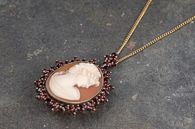 Lot 137 - A garnet and carved cameo pendant brooch