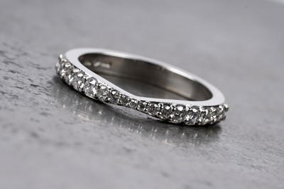 Lot 130 - A diamond half hoop eternity ring
