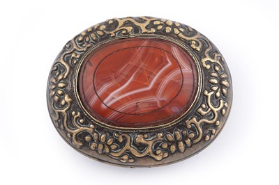 Lot 533 - A large brass buckle of domed oval form