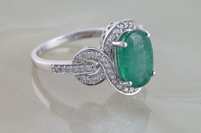 Lot 232 - Lorique: an emerald and diamond dress ring