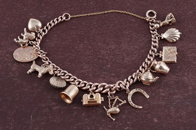 Lot 38 - A 9ct rose gold charm bracelet