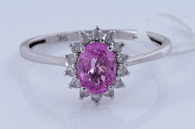 Lot 166 - A contemporary pink sapphire and diamond ring