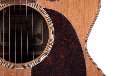 Lot 83 - A Takamine six string electro acoustic guitar