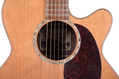 Lot 83 - A Takamine six string electro acoustic guitar