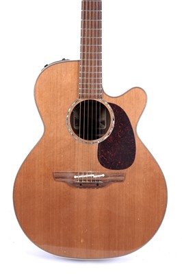 Lot 83 - A Takamine six string electro acoustic guitar