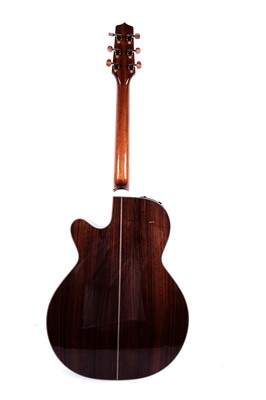 Lot 83 - A Takamine six string electro acoustic guitar