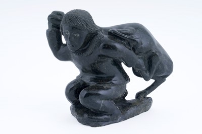 Lot 317 - A carved Inuit soapstone figure