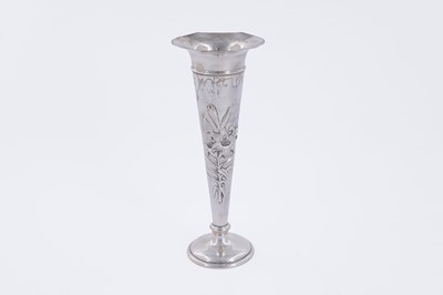 Lot 88 - An Edwardian silver trumpet-form vase relief-decorated with lilies
