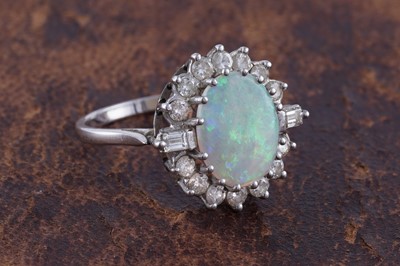Lot 295 - An opal and diamond cluster ring