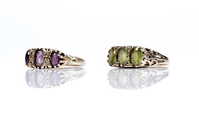 Lot 185 - A peridot ring; and an amethyst and diamond ring