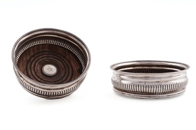 Lot 98 - A pair of George III silver wine coasters