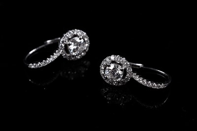 Lot 927 - A pair of diamond cluster earrings