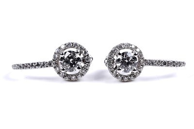 Lot 927 - A pair of diamond cluster earrings