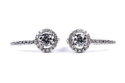 Lot 927 - A pair of diamond cluster earrings