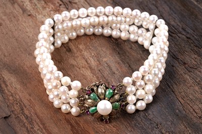Lot 8 - A ruby, jadeite, and four-strand cultured pearl bracelet