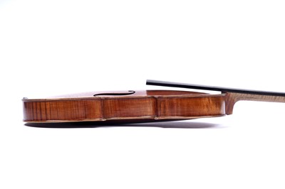 Lot 32 - A violin; and two bows