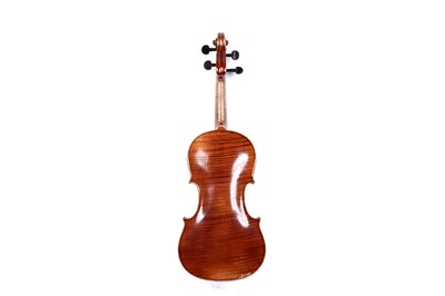 Lot 32 - A violin; and two bows