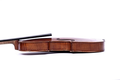 Lot 32 - A violin; and two bows