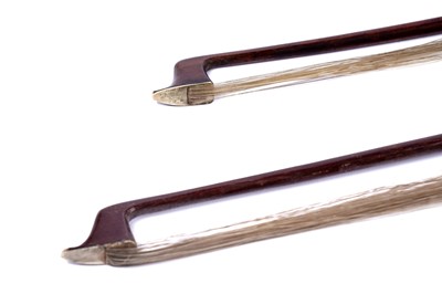 Lot 32 - A violin; and two bows