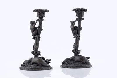 Lot 1030 - A pair of 19th Century patinated bronze zoomorphic candlesticks