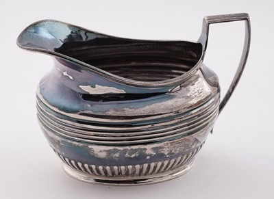 Lot 103 - A late Victorian/Edwardian silver three-piece tea set