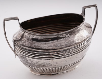 Lot 103 - A late Victorian/Edwardian silver three-piece tea set