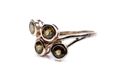 Lot 55 - A four stone sphene ring