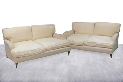 Lot 2 - In the style of Howard & Sons: a pair of substantial sofas