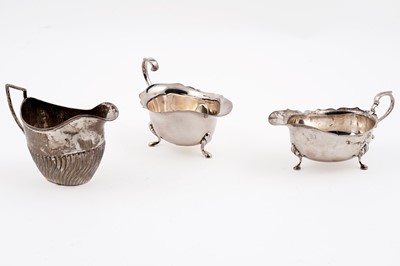 Lot 98 - A silver cream jug; and a similar plated sauceboat