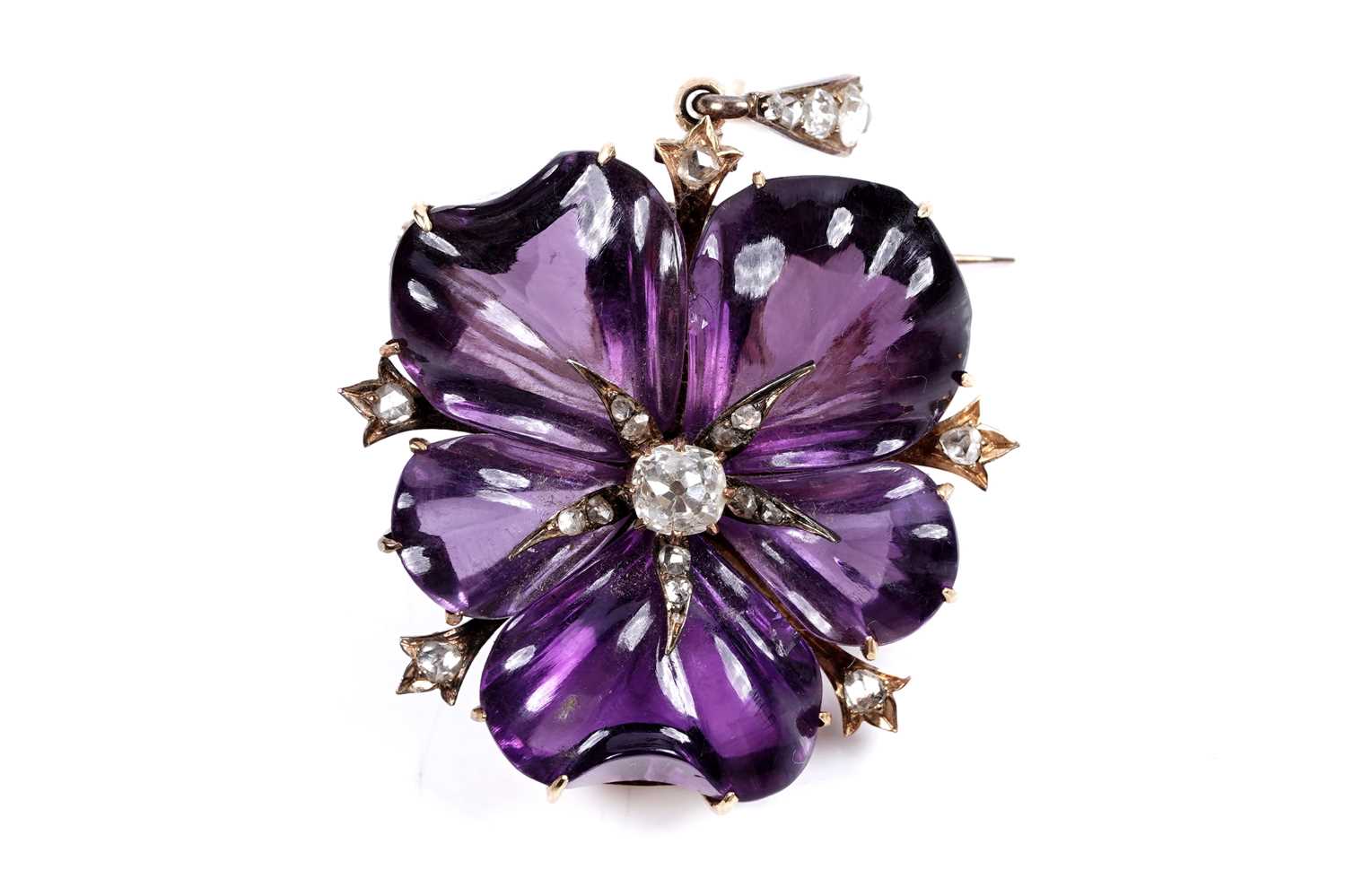 Lot 930 - A Victorian carved amethyst and diamond pendant/brooch